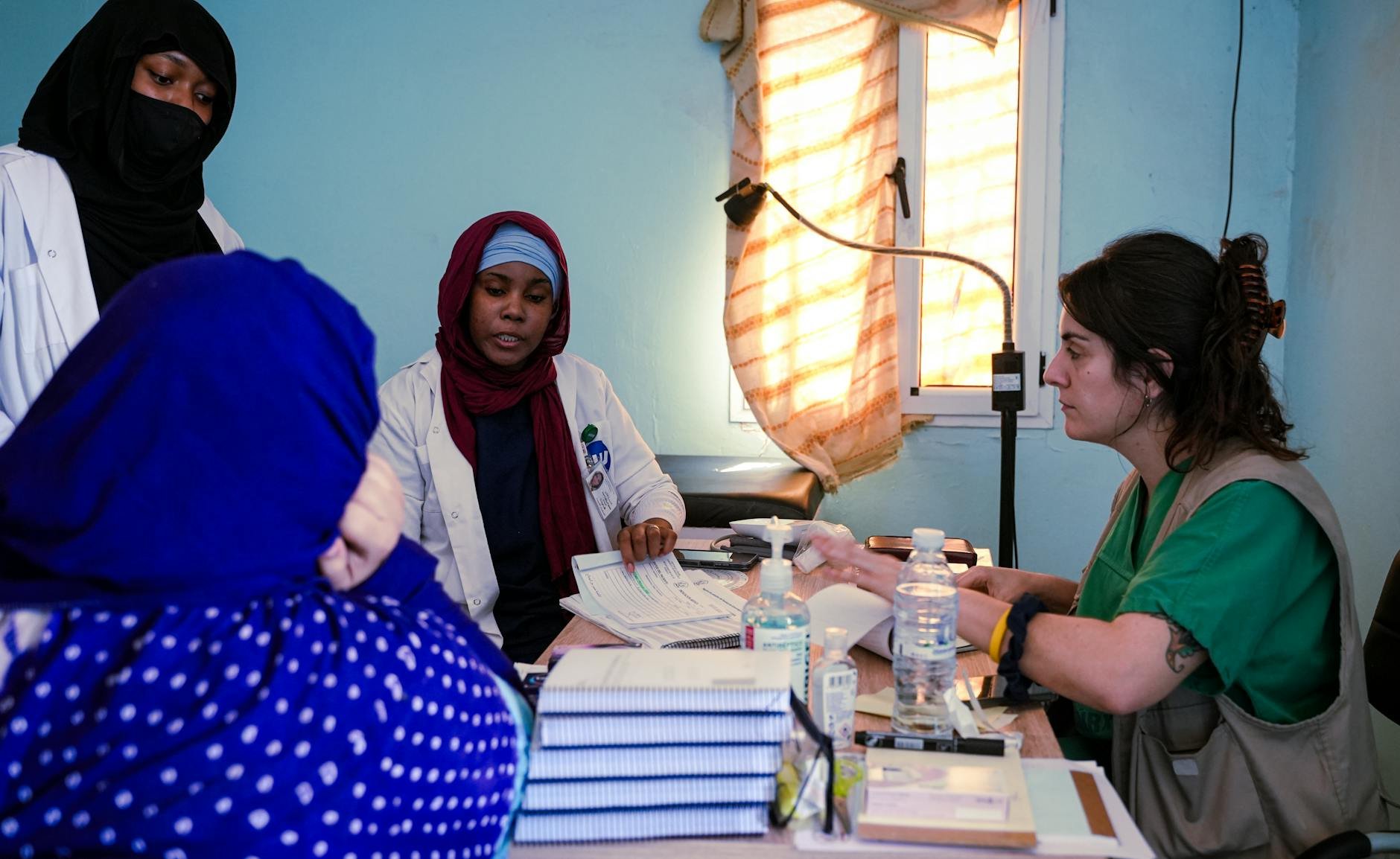 doctor and female patient discussing health results at a modern clinic - women's heart health