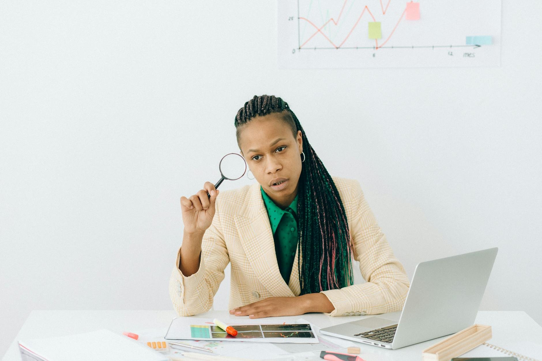 magnifying glass examining a stack of scientific research papers on a desk, symbolizing critical evaluation - Mind Clarity Tips
