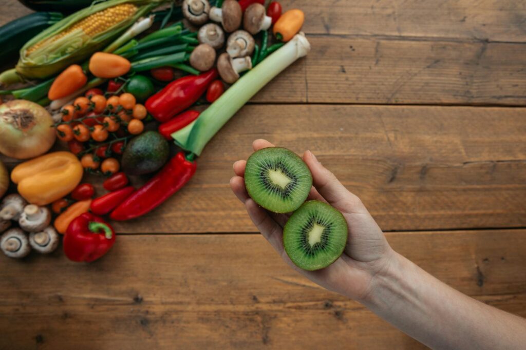 vibrant whole foods spread on a rustic wooden table, overhead shot - metabolic health