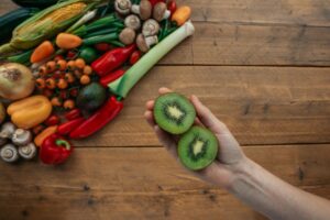 vibrant whole foods spread on a rustic wooden table, overhead shot - metabolic health