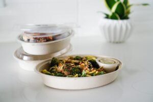 woman in her 30s enjoying a vibrant plant-based meal outdoors - women's heart health