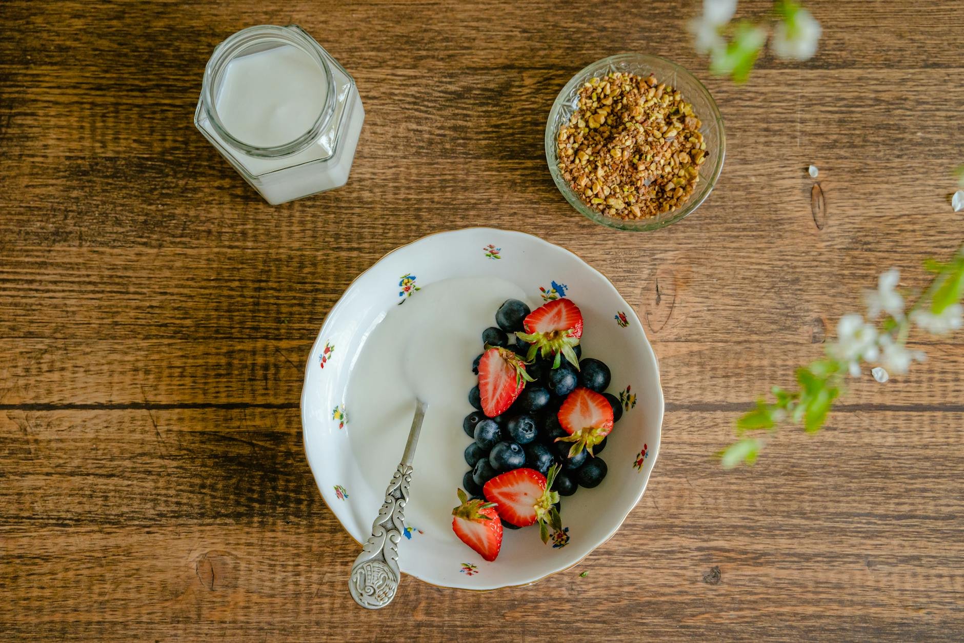 Delicious bowl of oatmeal with fresh berries, nuts, and seeds, healthy breakfast on a rustic wooden background. - Gut Health After 40