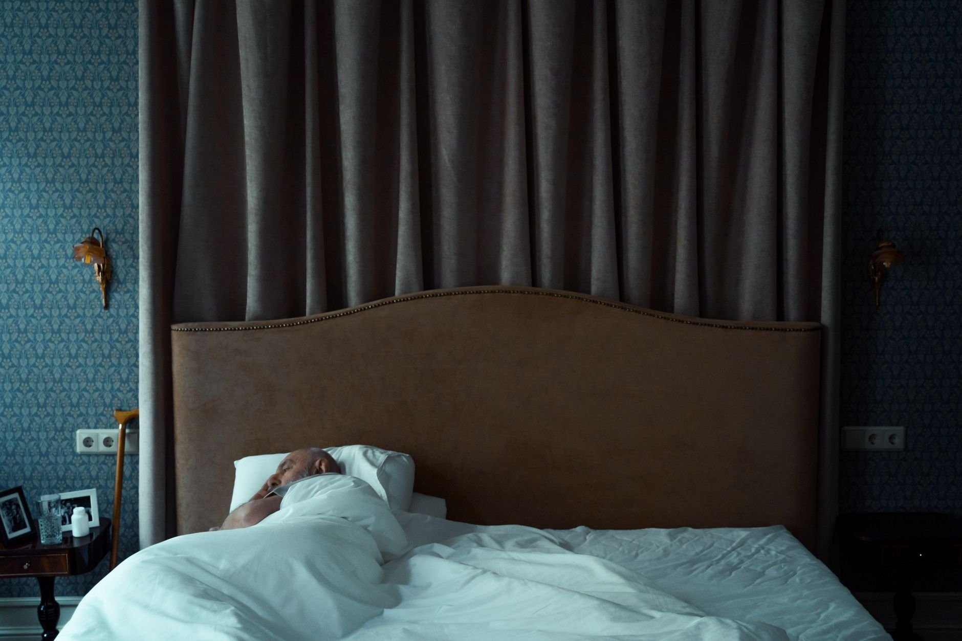 Comfortable bedroom with soft pillows, person sleeping soundly - Magnesium Deficiency Signs