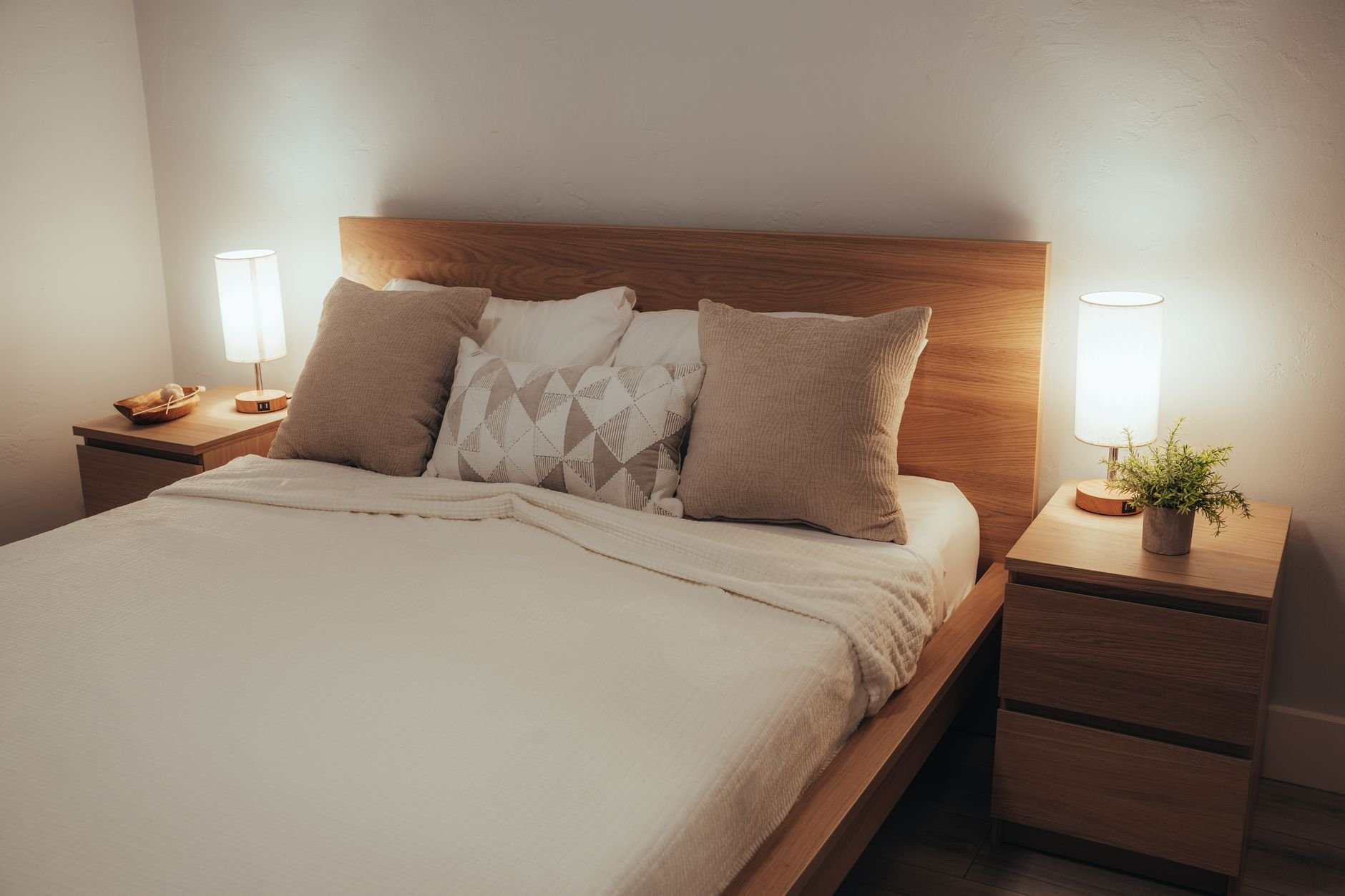 A peaceful European city bedroom at dusk with warm, inviting lights - Magnesium for sleep