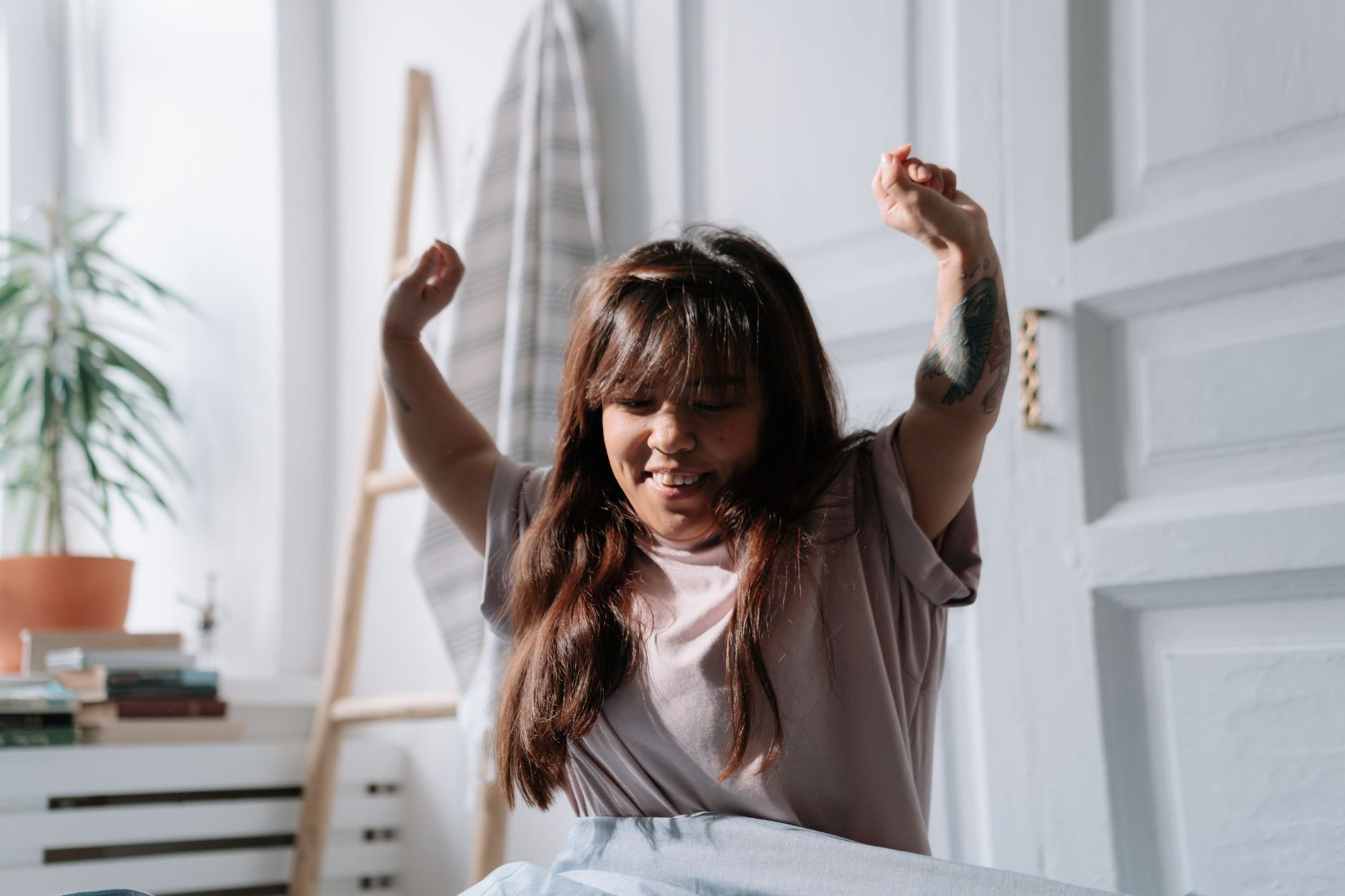 Young adult enjoying a serene morning stretch and waking up refreshed - Magnesium for sleep